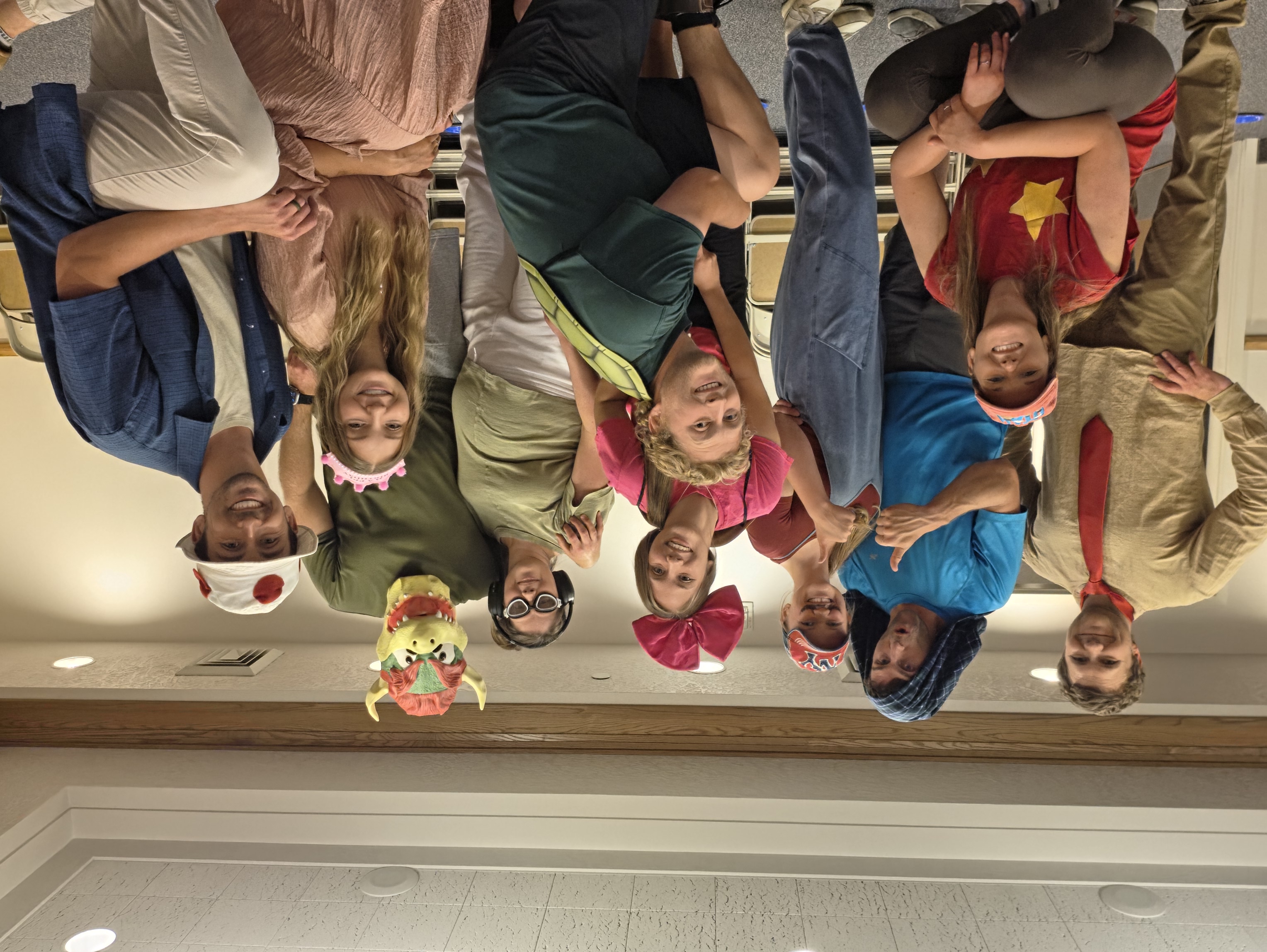 Group photo in costume at a Who's In? Games event